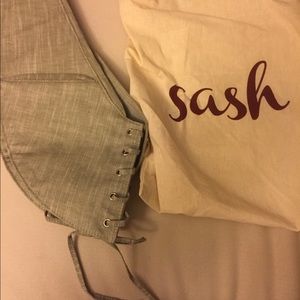Light gray cloth Sash bag, like new.